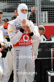 Jenson Button (GBR) McLaren on the grid. 08.07.2012. Formula 1 World Championship, Rd 9, British Grand Prix, Silverstone, England, Race Day