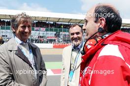 Mario Illien (SUI) Ilmor Engine Designer and Paulo Martinelli (ITA) Ferrari Engine Director. 08.07.2012. Formula 1 World Championship, Rd 9, British Grand Prix, Silverstone, England, Race Day