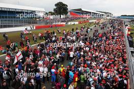 Fans invade the circuit. 08.07.2012. Formula 1 World Championship, Rd 9, British Grand Prix, Silverstone, England, Race Day
