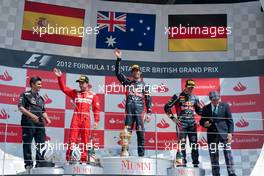 The podium (L to R): Fernando Alonso (ESP) Ferrari, second; Mark Webber (AUS) Red Bull Racing, race winner; Sebastian Vettel (GER) Red Bull Racing, third; Jackie Stewart (GBR). 08.07.2012. Formula 1 World Championship, Rd 9, British Grand Prix, Silverstone, England, Race Day