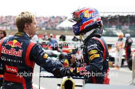 Race winner Mark Webber (AUS) Red Bull Racing RB8 celebrates in parc ferme with team mate Sebastian Vettel (GER) Red Bull Racing. 08.07.2012. Formula 1 World Championship, Rd 9, British Grand Prix, Silverstone, England, Race Day