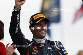 Race winner Mark Webber (AUS) Red Bull Racing celebrates on the podium. 08.07.2012. Formula 1 World Championship, Rd 9, British Grand Prix, Silverstone, England, Race Day