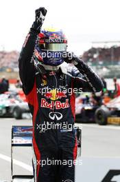 Race winner Mark Webber (AUS) Red Bull Racing RB8 celebrates in parc ferme. 08.07.2012. Formula 1 World Championship, Rd 9, British Grand Prix, Silverstone, England, Race Day
