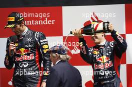 The podium (L to R): Race winner Mark Webber (AUS) Red Bull Racing with Jackie Stewart (GBR) and Sebastian Vettel (GER) Red Bull Racing. 08.07.2012. Formula 1 World Championship, Rd 9, British Grand Prix, Silverstone, England, Race Day