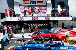 The podium (L to R): Fernando Alonso (ESP) Ferrari, second; Mark Webber (AUS) Red Bull Racing, race winner; Sebastian Vettel (GER) Red Bull Racing, third.. 08.07.2012. Formula 1 World Championship, Rd 9, British Grand Prix, Silverstone, England, Race Day