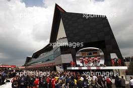 The podium (L to R): Fernando Alonso (ESP) Ferrari, second; Mark Webber (AUS) Red Bull Racing, race winner; Sebastian Vettel (GER) Red Bull Racing, third. 08.07.2012. Formula 1 World Championship, Rd 9, British Grand Prix, Silverstone, England, Race Day