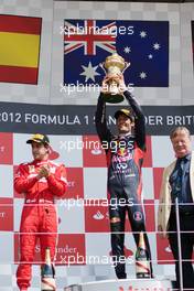 The podium (L to R): Fernando Alonso (ESP) Ferrari, second; Mark Webber (AUS) Red Bull Racing, race winner. 08.07.2012. Formula 1 World Championship, Rd 9, British Grand Prix, Silverstone, England, Race Day