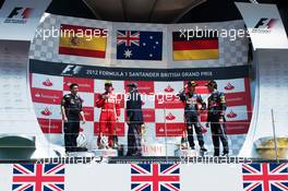 The podium (L to R): Fernando Alonso (ESP) Ferrari, second; Jackie Stewart (GBR); Sebastian Vettel (GER) Red Bull Racing, third; Mark Webber (AUS) Red Bull Racing, race winner. 08.07.2012. Formula 1 World Championship, Rd 9, British Grand Prix, Silverstone, England, Race Day