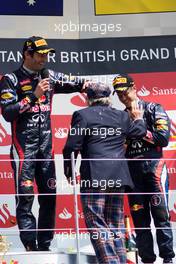 (L to R): Mark Webber (AUS) Red Bull Racing with Jackie Stewart (GBR) and Sebastian Vettel (GER) Red Bull Racing on the podium. 08.07.2012. Formula 1 World Championship, Rd 9, British Grand Prix, Silverstone, England, Race Day