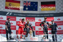 The podium (L to R): Fernando Alonso (ESP) Ferrari, second; Mark Webber (AUS) Red Bull Racing, race winner; Sebastian Vettel (GER) Red Bull Racing, third; Jackie Stewart (GBR). 08.07.2012. Formula 1 World Championship, Rd 9, British Grand Prix, Silverstone, England, Race Day