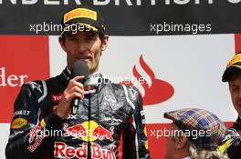 Race winner Mark Webber (AUS) Red Bull Racing celebrates on the podium. 08.07.2012. Formula 1 World Championship, Rd 9, British Grand Prix, Silverstone, England, Race Day