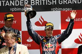 Sebastian Vettel (GER) Red Bull Racing celebrates his third position on the podium. 08.07.2012. Formula 1 World Championship, Rd 9, British Grand Prix, Silverstone, England, Race Day