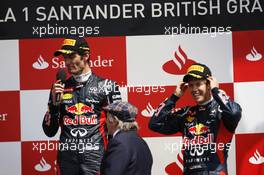 The podium (L to R): Race winner Mark Webber (AUS) Red Bull Racing with Jackie Stewart (GBR) and Sebastian Vettel (GER) Red Bull Racing. 08.07.2012. Formula 1 World Championship, Rd 9, British Grand Prix, Silverstone, England, Race Day