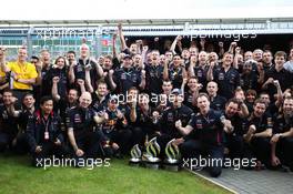 Race winner Mark Webber (AUS) Red Bull Racing celebrates with the team. 08.07.2012. Formula 1 World Championship, Rd 9, British Grand Prix, Silverstone, England, Race Day