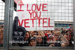 Fans and a banner for Sebastian Vettel (GER) Red Bull Racing. 08.07.2012. Formula 1 World Championship, Rd 9, British Grand Prix, Silverstone, England, Race Day