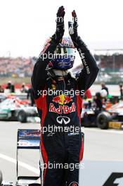 Race winner Mark Webber (AUS) Red Bull Racing RB8 celebrates in parc ferme. 08.07.2012. Formula 1 World Championship, Rd 9, British Grand Prix, Silverstone, England, Race Day