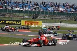 Fernando Alonso (ESP), Scuderia Ferrari leads the start of the race  08.07.2012. Formula 1 World Championship, Rd 9, British Grand Prix, Silverstone, England, Race Day