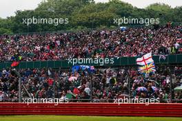Fans in the grandstand. 08.07.2012. Formula 1 World Championship, Rd 9, British Grand Prix, Silverstone, England, Race Day
