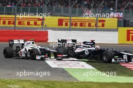Pastor Maldonado (VEN) Williams FW34 and Sergio Perez (MEX) Sauber C31 collide. 08.07.2012. Formula 1 World Championship, Rd 9, British Grand Prix, Silverstone, England, Race Day
