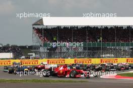 Fernando Alonso (ESP) Ferrari F2012 leads at the start of the race. 08.07.2012. Formula 1 World Championship, Rd 9, British Grand Prix, Silverstone, England, Race Day