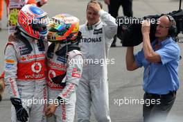Jenson Button (GBR), McLaren Mercedes and Lewis Hamilton (GBR), McLaren Mercedes, parc ferme 08.07.2012. Formula 1 World Championship, Rd 9, British Grand Prix, Silverstone, England, Race Day