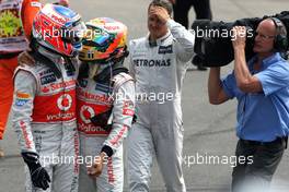 Jenson Button (GBR), McLaren Mercedes and Lewis Hamilton (GBR), McLaren Mercedes, parc ferme 08.07.2012. Formula 1 World Championship, Rd 9, British Grand Prix, Silverstone, England, Race Day