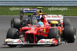 Fernando Alonso (ESP) Ferrari F2012 leads Mark Webber (AUS) Red Bull Racing RB8. 08.07.2012. Formula 1 World Championship, Rd 9, British Grand Prix, Silverstone, England, Race Day