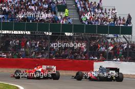 Fernando Alonso (ESP) Ferrari F2012 and Lewis Hamilton (GBR) McLaren MP4/27 battle for position. 08.07.2012. Formula 1 World Championship, Rd 9, British Grand Prix, Silverstone, England, Race Day