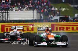Nico Hulkenberg (GER) Sahara Force India F1 VJM05 leads Kamui Kobayashi (JPN) Sauber C31. 08.07.2012. Formula 1 World Championship, Rd 9, British Grand Prix, Silverstone, England, Race Day