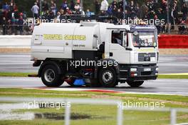 A sweeper truck is used to try and dry the circuit after qualifying is delayed by rain. 07.07.2012. Formula 1 World Championship, Rd 9, British Grand Prix, Silverstone, England, Qualifying Day