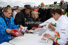 Paul di Resta (GBR) Sahara Force India F1 signs autographs for the fans. 07.07.2012. Formula 1 World Championship, Rd 9, British Grand Prix, Silverstone, England, Qualifying Day