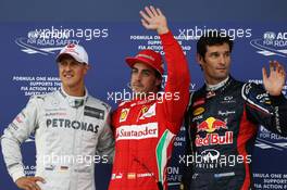 Qualifying parc ferme top three (L to R): Michael Schumacher (GER) Mercedes AMG F1, third; Fernando Alonso (ESP) Ferrari, pole position; Mark Webber (AUS) Red Bull Racing, second. 07.07.2012. Formula 1 World Championship, Rd 9, British Grand Prix, Silverstone, England, Qualifying Day