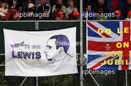 Banner and flag for Lewis Hamilton (GBR) McLaren.