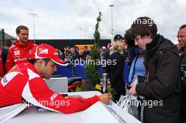 Felipe Massa (BRA) Ferrari signs autographs for the fans. 07.07.2012. Formula 1 World Championship, Rd 9, British Grand Prix, Silverstone, England, Qualifying Day