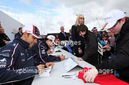 Pastor Maldonado (VEN) Williams and Bruno Senna (BRA) Williams sign autographs for the fans. 07.07.2012. Formula 1 World Championship, Rd 9, British Grand Prix, Silverstone, England, Qualifying Day