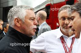 (L to R): Derek Warwick (GBR) BRDC President with Richard Phillips (GBR) CEO Silverstone and Pasquale Lattuneddu (ITA) of the FOM. 07.07.2012. Formula 1 World Championship, Rd 9, British Grand Prix, Silverstone, England, Qualifying Day