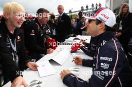 Bruno Senna (BRA) Williams signs autographs for the fans. 07.07.2012. Formula 1 World Championship, Rd 9, British Grand Prix, Silverstone, England, Qualifying Day