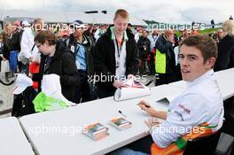 Paul di Resta (GBR) Sahara Force India F1 signs autographs for the fans. 07.07.2012. Formula 1 World Championship, Rd 9, British Grand Prix, Silverstone, England, Qualifying Day