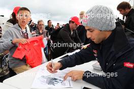 Daniel Ricciardo (AUS) Scuderia Toro Rosso signs autographs for the fans. 07.07.2012. Formula 1 World Championship, Rd 9, British Grand Prix, Silverstone, England, Qualifying Day