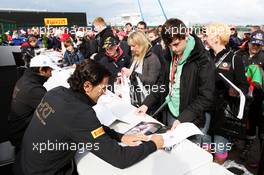 Pedro De La Rosa (ESP) HRT Formula 1 Team signs autographs for the fans. 07.07.2012. Formula 1 World Championship, Rd 9, British Grand Prix, Silverstone, England, Qualifying Day