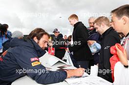 Jean-Eric Vergne (FRA) Scuderia Toro Rosso STR7 signs autographs for the fans. 07.07.2012. Formula 1 World Championship, Rd 9, British Grand Prix, Silverstone, England, Qualifying Day