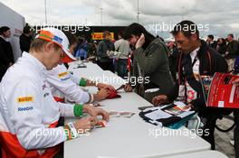 Nico Hulkenberg (GER) Sahara Force India F1 signs autographs for the fans. 07.07.2012. Formula 1 World Championship, Rd 9, British Grand Prix, Silverstone, England, Qualifying Day