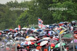 Fans brave the rain in the grandstands. 07.07.2012. Formula 1 World Championship, Rd 9, British Grand Prix, Silverstone, England, Qualifying Day