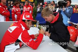Fernando Alonso (ESP) Ferrari signs autographs for the fans. 07.07.2012. Formula 1 World Championship, Rd 9, British Grand Prix, Silverstone, England, Qualifying Day