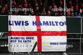 A flag for Lewis Hamilton (GBR) McLaren.
