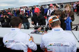 (L to R): Paul di Resta (GBR) Sahara Force India F1 and Nico Hulkenberg (GER) Sahara Force India F1 sign autographs for the fans. 07.07.2012. Formula 1 World Championship, Rd 9, British Grand Prix, Silverstone, England, Qualifying Day