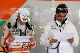 (L to R): Nico Hulkenberg (GER) Sahara Force India F1 and Bradley Joyce (GBR) Sahara Force India F1 Race Engineer. 07.07.2012. Formula 1 World Championship, Rd 9, British Grand Prix, Silverstone, England, Qualifying Day