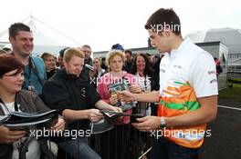Paul di Resta (GBR) Sahara Force India F1 signs autographs for the fans at the post race concert. 08.07.2012. Formula 1 World Championship, Rd 9, British Grand Prix, Silverstone, England, Race Day