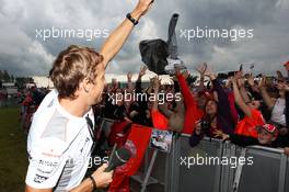 Jenson Button (GBR) McLaren with the fans at the post race concert. 08.07.2012. Formula 1 World Championship, Rd 9, British Grand Prix, Silverstone, England, Race Day