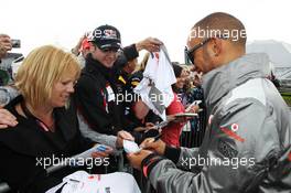 Lewis Hamilton (GBR) McLaren signs autographs for the fans at the post race concert. 08.07.2012. Formula 1 World Championship, Rd 9, British Grand Prix, Silverstone, England, Race Day
